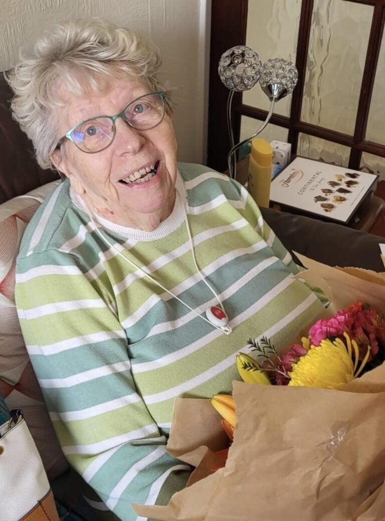 Caregiver providing personal care to elderly client